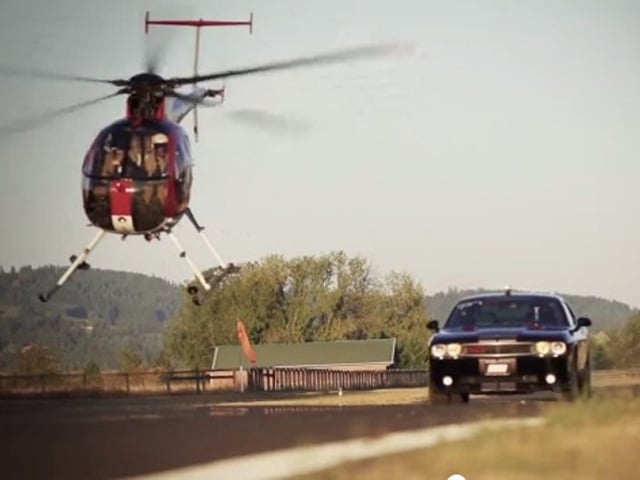 Video: Who Wins, A Helicopter Or A Challenger SRT8?