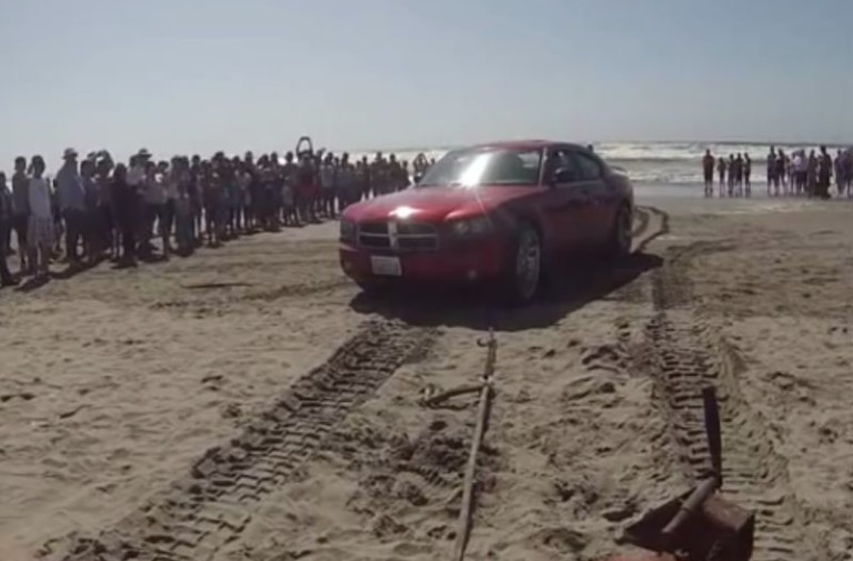 Video: Charger Owner Mistakes Beach For Parking Lot, Tide Comes In